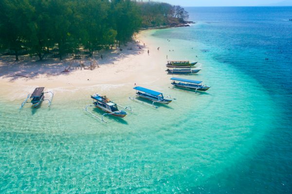 Image,Of,Tourist,Ships,Anchored,On,The,Gili,Rengit,Beach